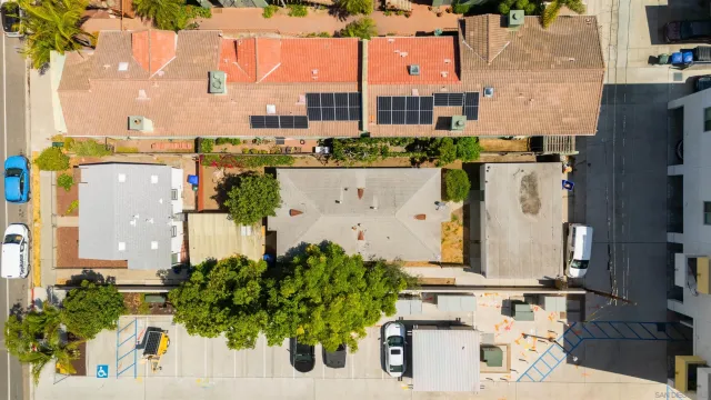 an aerial view of residential houses with outdoor space