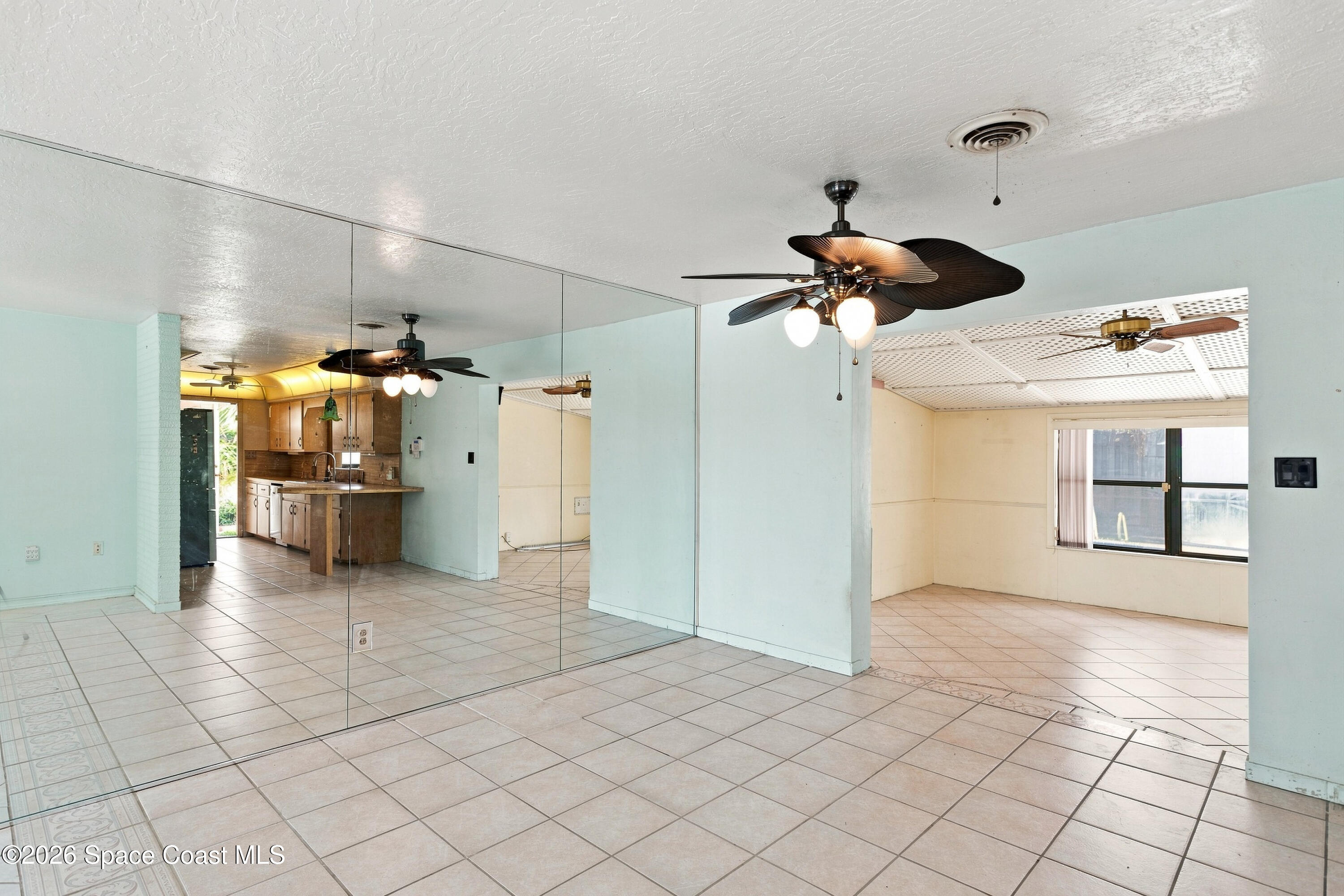 335 Brewster Road Indialantic, FL 32903 - Photo 10 of 33 View into Florida Room