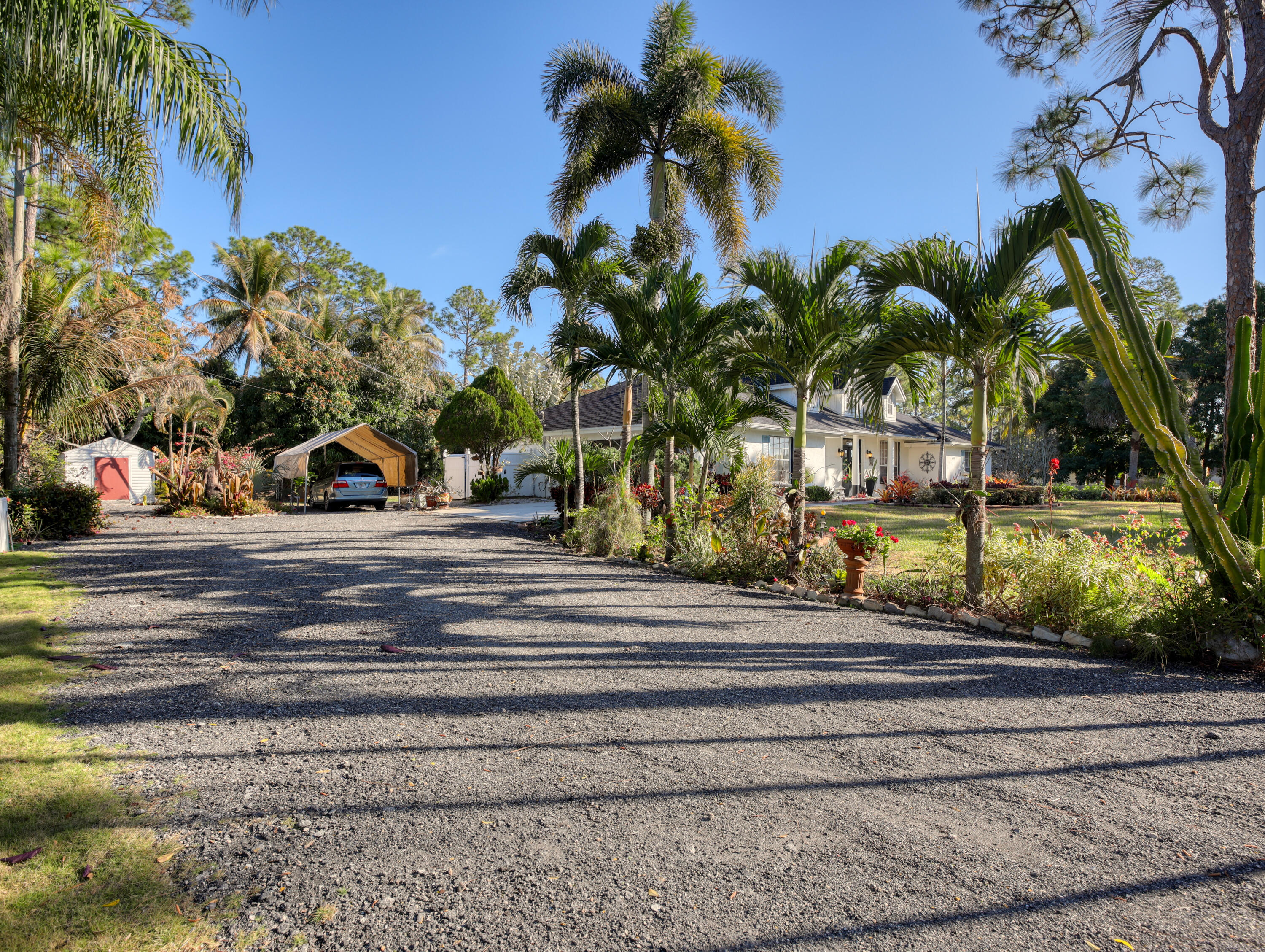 15049 85th Road North The Acreage, FL 33470 - Photo 11 of 60 a view of a terrace with a fountain
