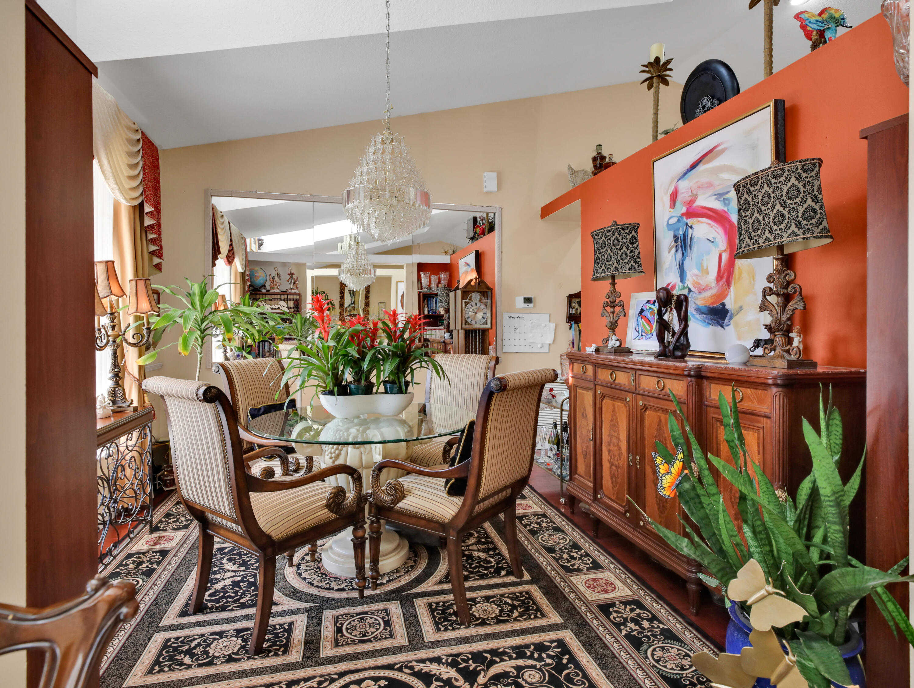 15049 85th Road North The Acreage, FL 33470 - Photo 21 of 60 a dining room filled with lots of potted plants