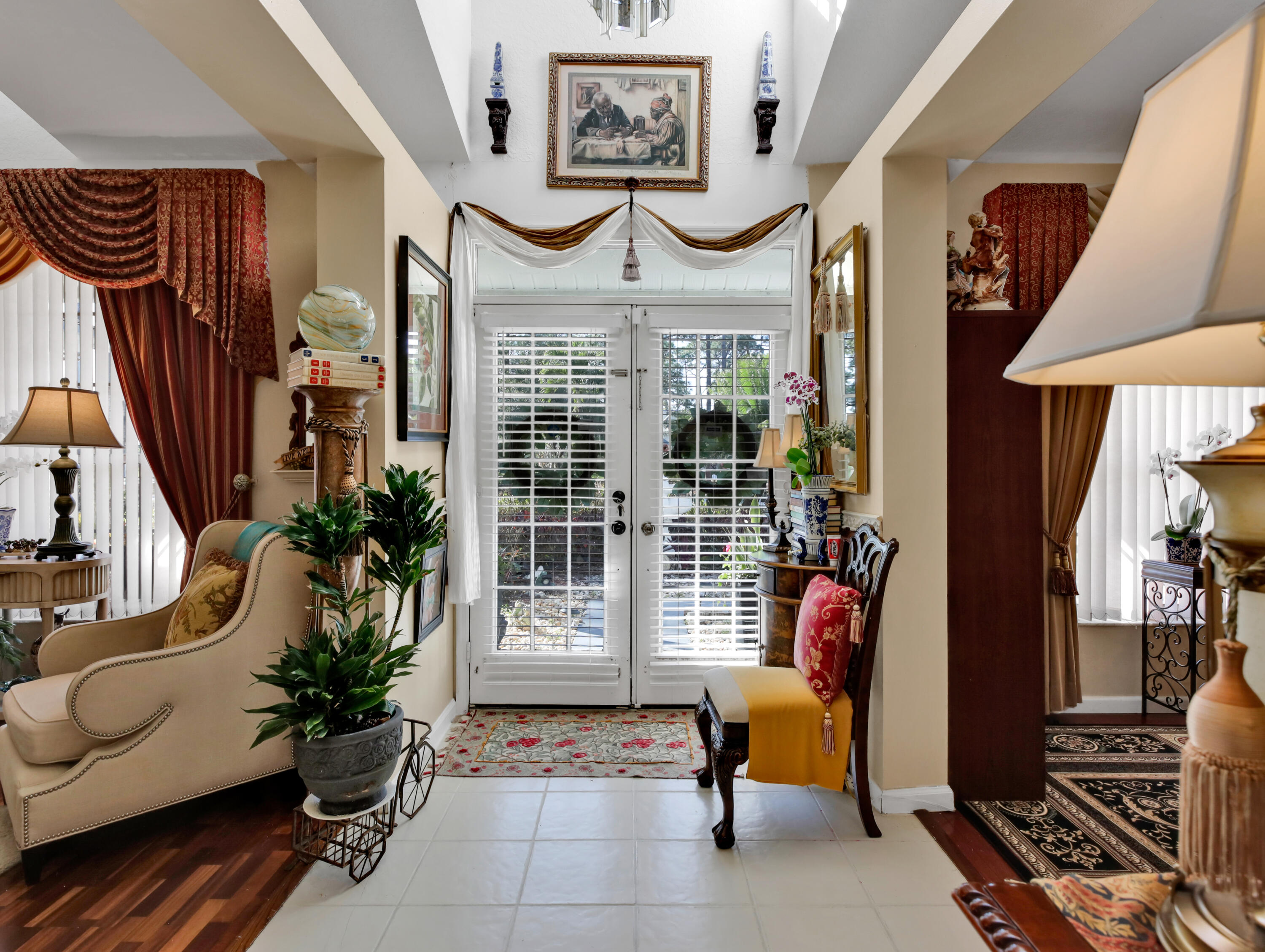 15049 85th Road North The Acreage, FL 33470 - Photo 24 of 60 a living room with furniture and a lamp