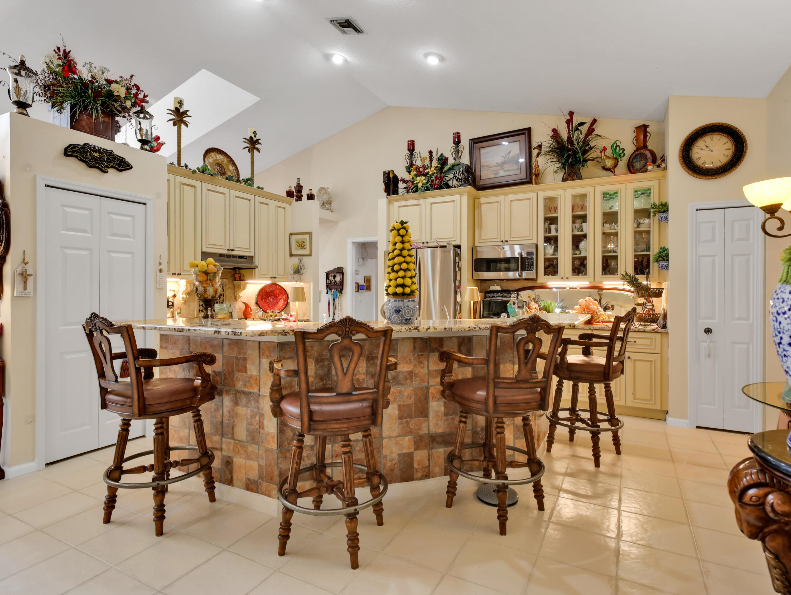 15049 85th Road North The Acreage, FL 33470 - Photo 27 of 60 a view of a dining room with furniture and wooden floor