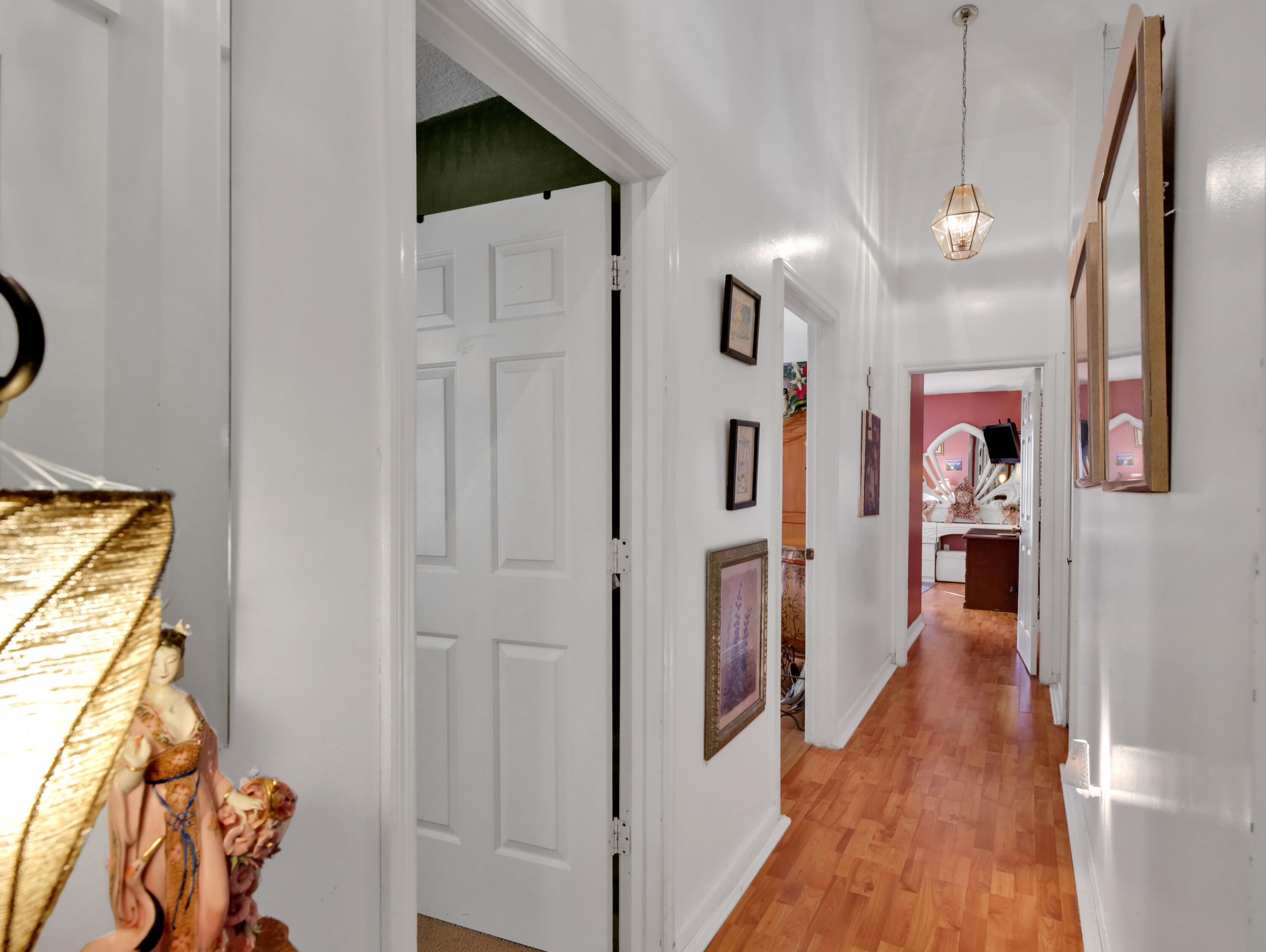 15049 85th Road North The Acreage, FL 33470 - Photo 50 of 60 a view of a hallway with wooden floor and entryway