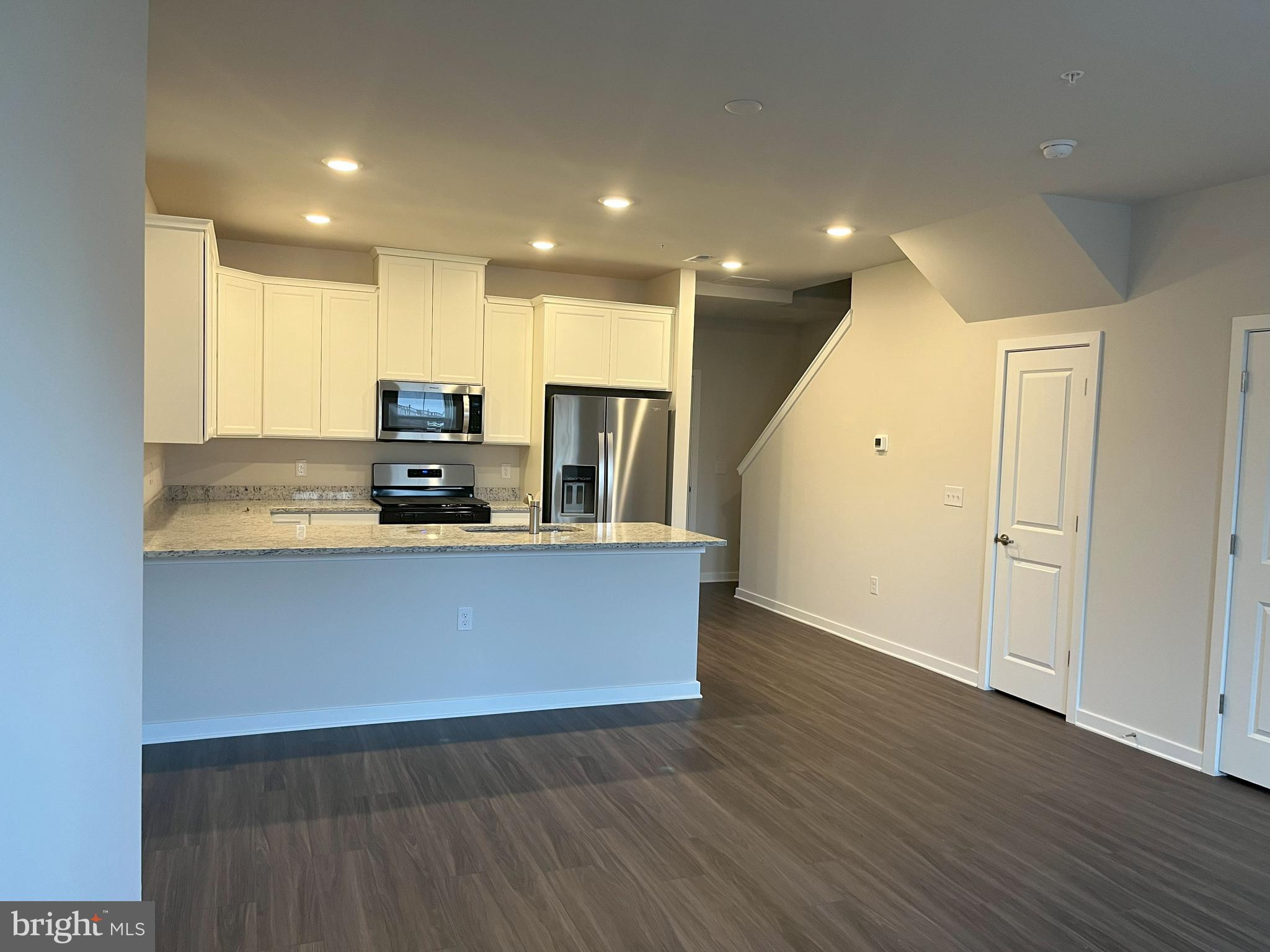 8 East Front Street Bridgeport, PA 19405 - Photo 13 of 38 a large kitchen with stainless steel appliances granite countertop a large counter top a wooden floors and a large window