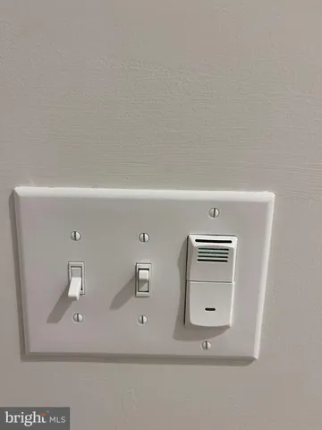 a view of cabinet with washer and dryer