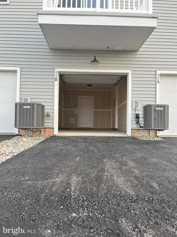 a view of a house with a yard and garage