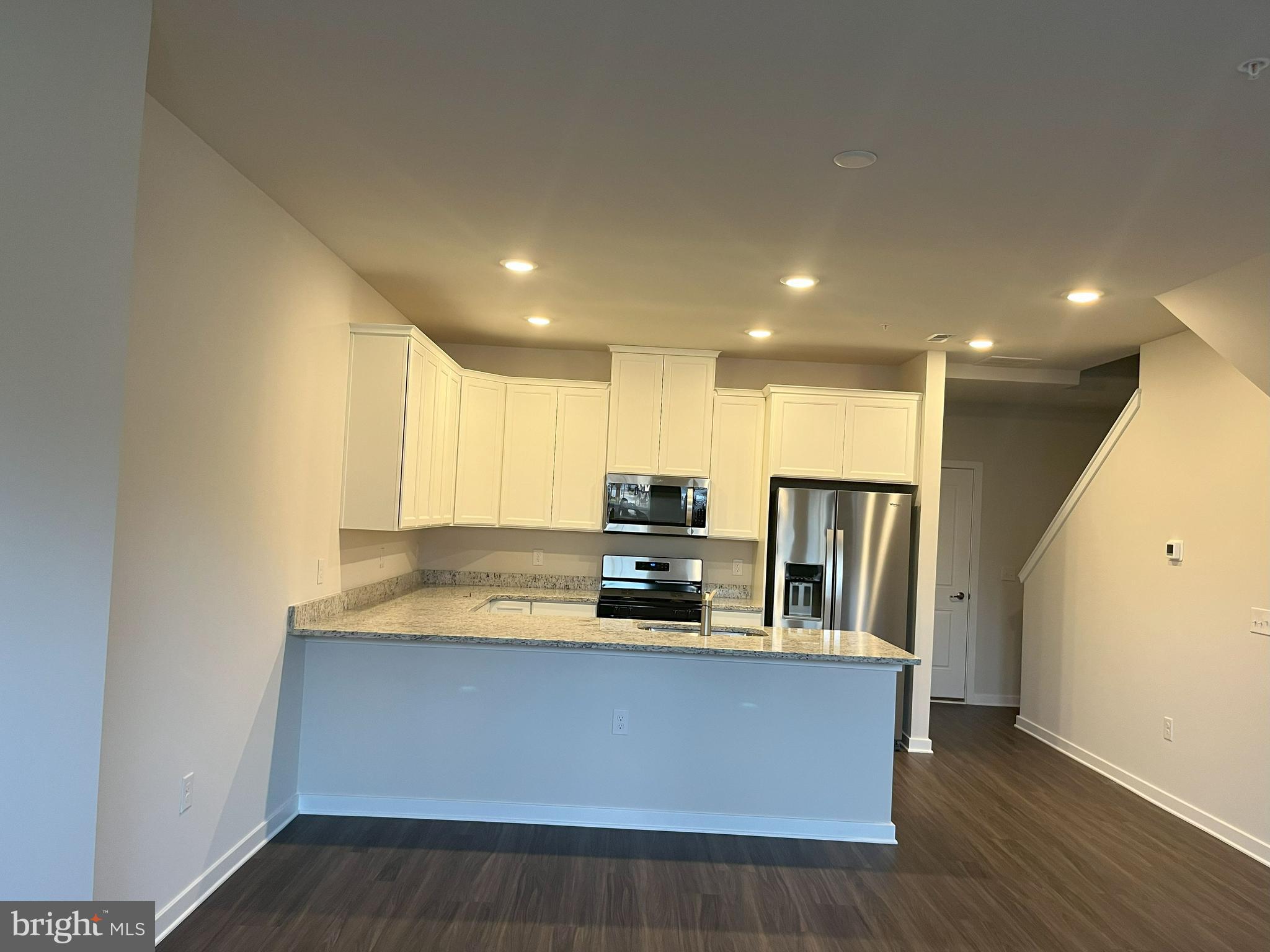 8 East Front Street Bridgeport, PA 19405 - Photo 6 of 38 a kitchen with stainless steel appliances granite countertop a sink a stove and a refrigerator