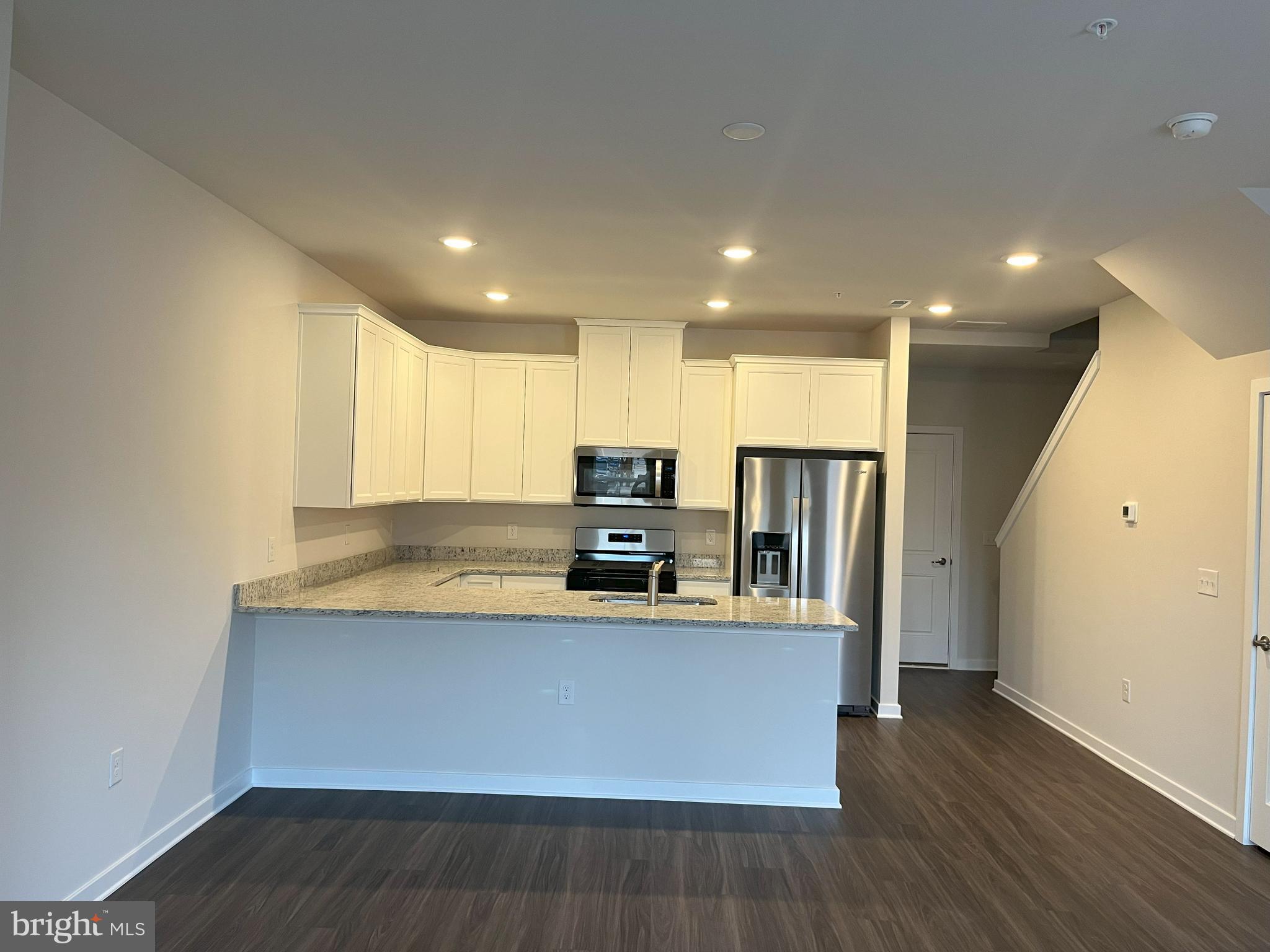 8 East Front Street Bridgeport, PA 19405 - Photo 8 of 38 a large kitchen with stainless steel appliances a large counter top a stove and a refrigerator