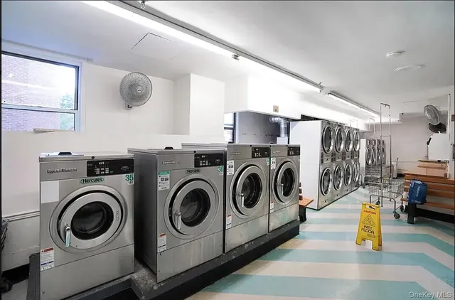 a utility room with sink dryer and washer