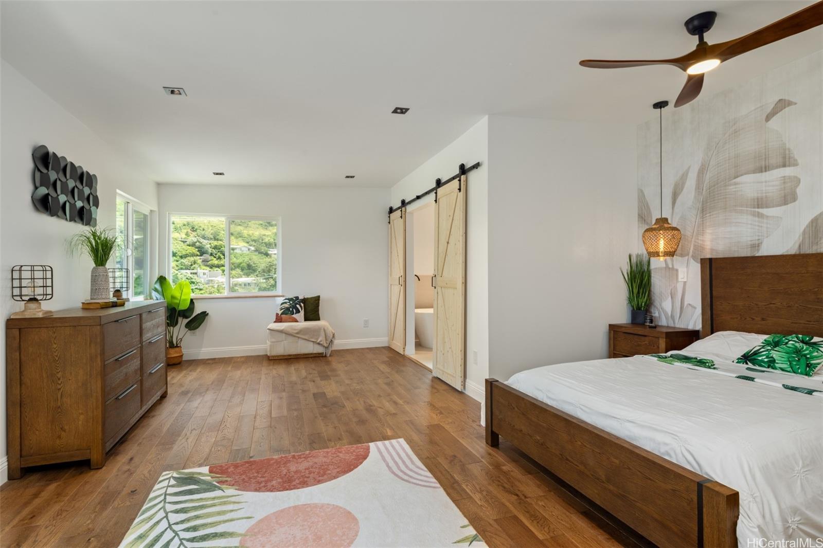 852 Kainoa Place Honolulu, HI 96821 - Photo 10 of 25 a bedroom with a bed and a dresser
