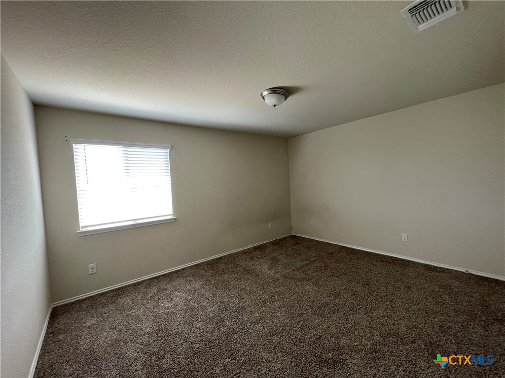 6416 Treiber Drive Temple, TX 76502 - Photo 12 of 19 an empty room with a empty space and windows