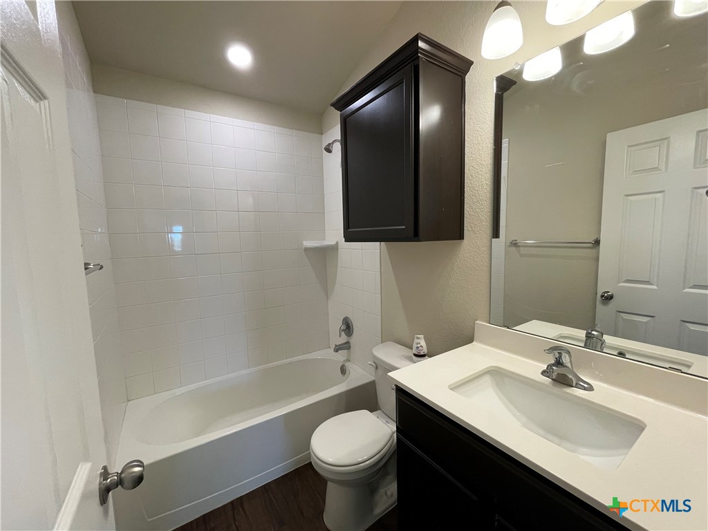 6416 Treiber Drive Temple, TX 76502 - Photo 14 of 19 a bathroom with a toilet sink and mirror