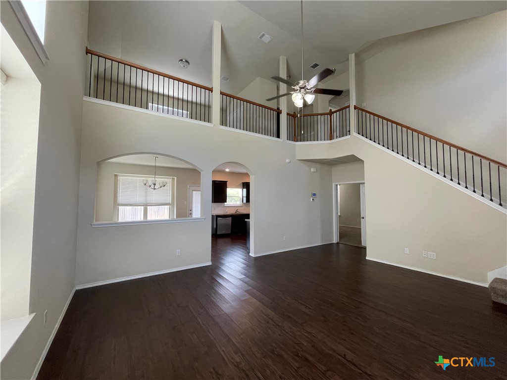 6416 Treiber Drive Temple, TX 76502 - Photo 2 of 19 an empty room with wooden floor chandelier and entryway