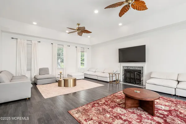 a living room with furniture and a fireplace