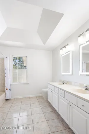 a view of a kitchen with a sink and a window