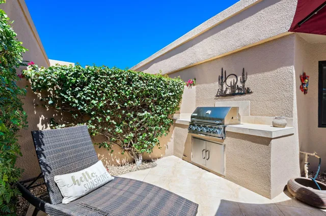 a view of a chairs and table in the patio