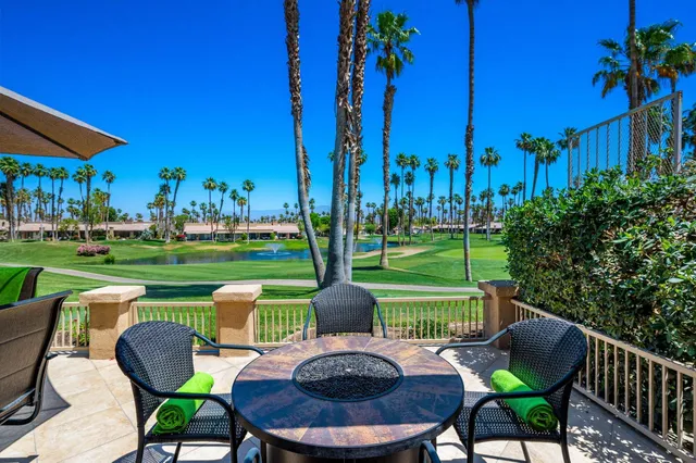 a chairs sitting in a yard with swimming pool