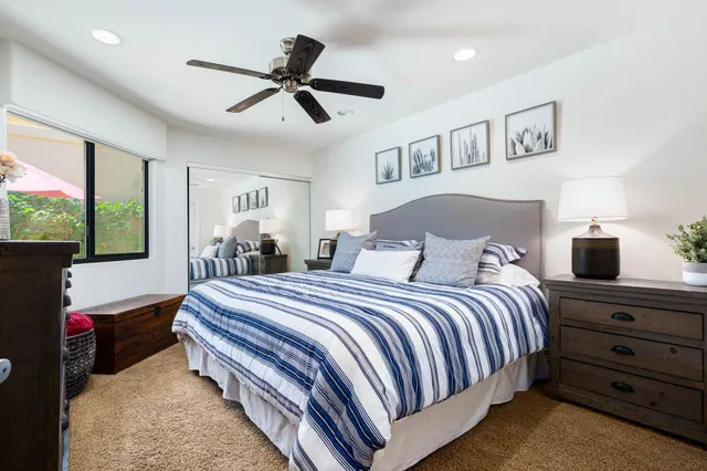 a bed room with a bed and a window