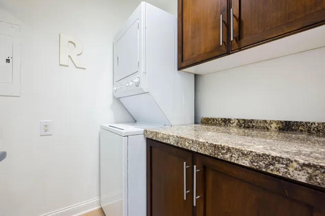 a kitchen with a granite countertop cabinets and sink