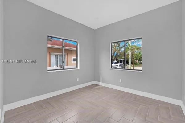a view of an empty room with a window