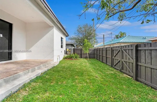 a view of backyard with green space