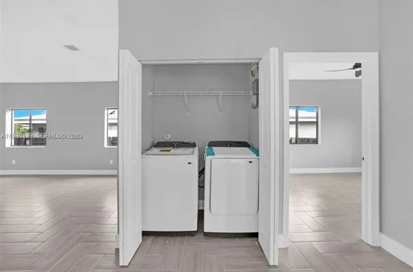 a view of hallway with wooden floor