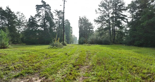a view of outdoor space with deck and yard