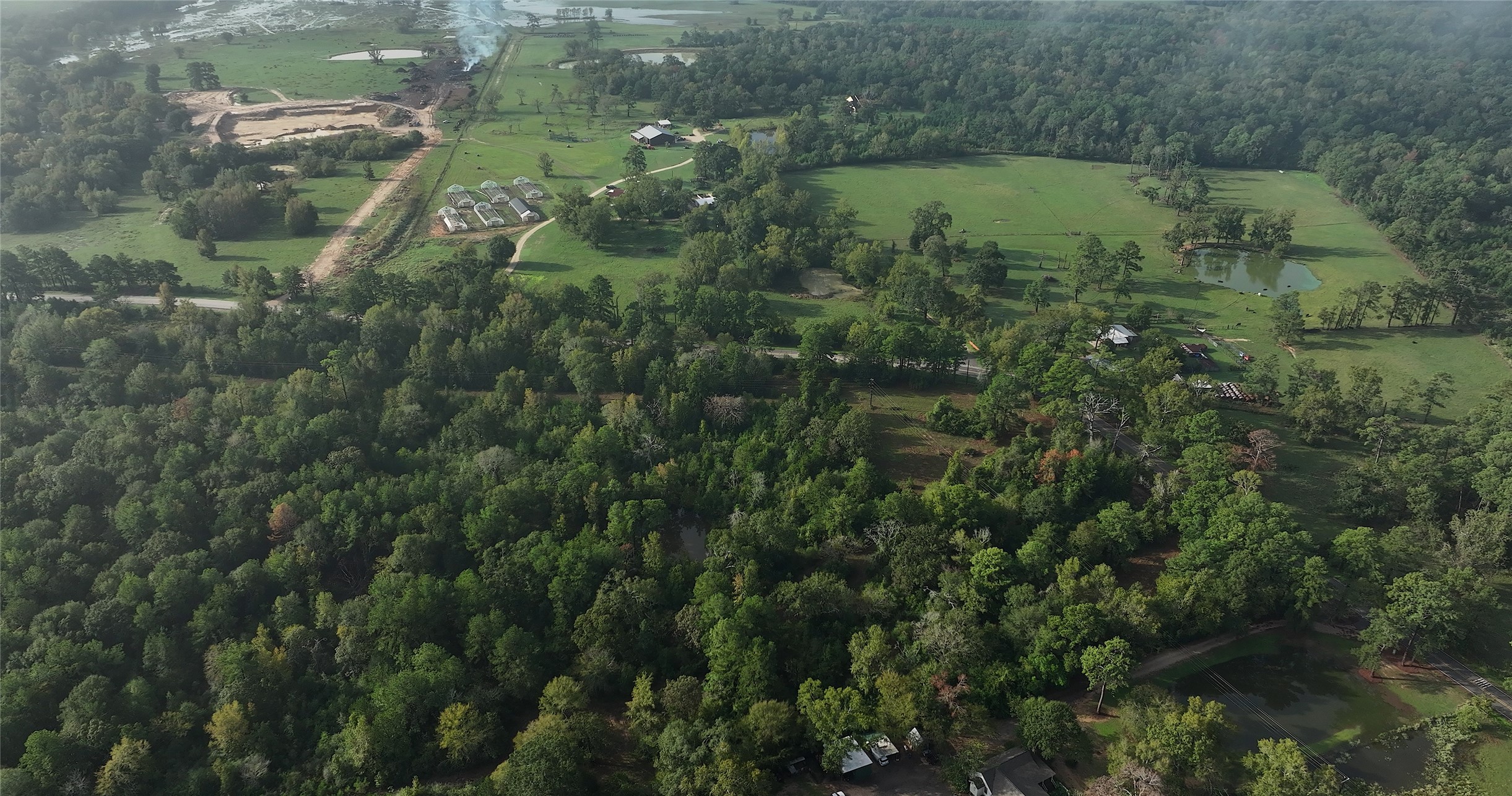 0 Spring Branch Road Montgomery, TX 77316 - Photo 2 of 17 an aerial view of residential houses with outdoor space and trees