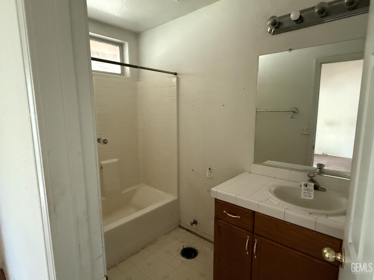 Undisclosed Address Tehachapi, CA 93561 - Photo 11 of 17 a bathroom with a shower sink vanity granite and shower