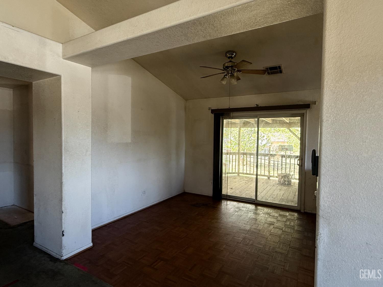 Undisclosed Address Tehachapi, CA 93561 - Photo 4 of 17 an empty room with windows and ceiling fan