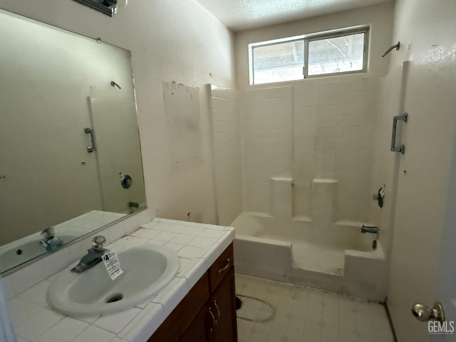 Undisclosed Address Tehachapi, CA 93561 - Photo 8 of 17 a bathroom with a sink shower and a mirror