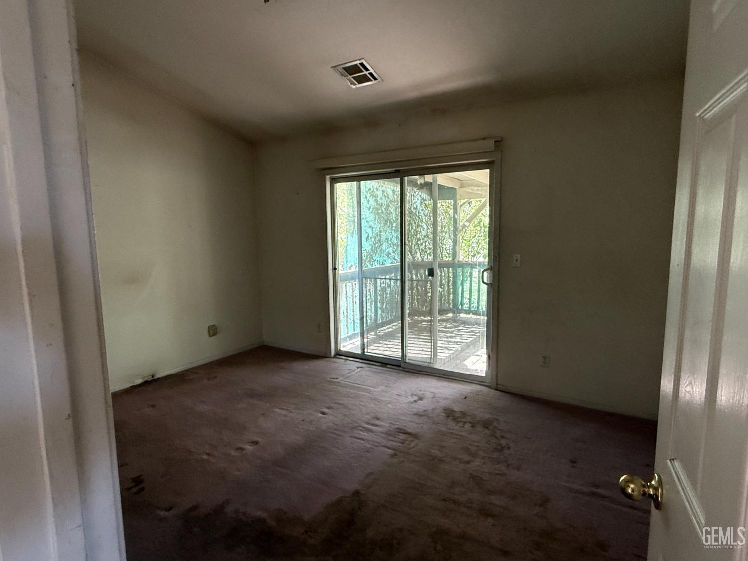 Undisclosed Address Tehachapi, CA 93561 - Photo 10 of 17 a view of an empty room with glass door