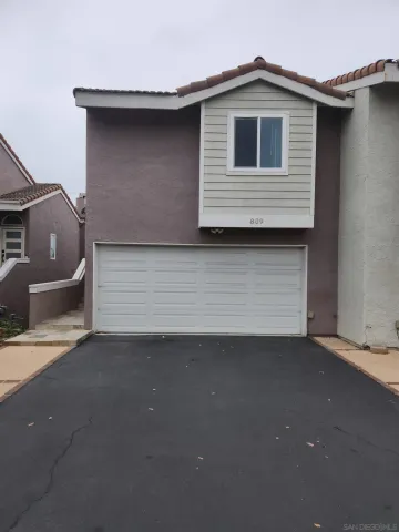 a front view of a house with garage