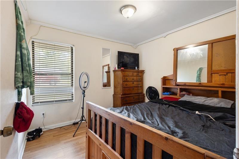 1496 Meadowlark Drive Decatur, GA 30032 - Photo 13 of 27 a bedroom with furniture and a window