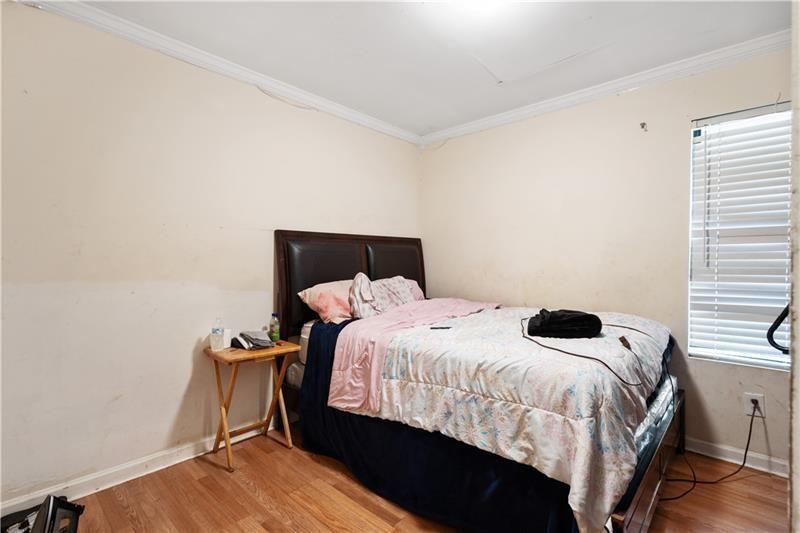 1496 Meadowlark Drive Decatur, GA 30032 - Photo 15 of 27 a bedroom with a bed and a table