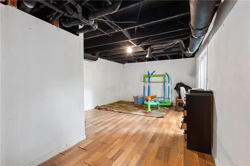 1496 Meadowlark Drive Decatur, GA 30032 - Photo 17 of 27 a bedroom with wooden floor