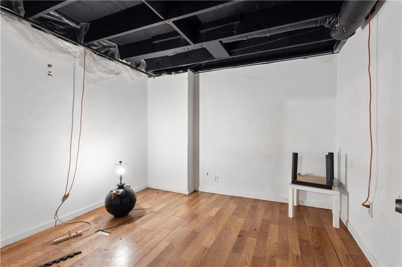 1496 Meadowlark Drive Decatur, GA 30032 - Photo 19 of 27 a view of a room with wooden floor and cabinets