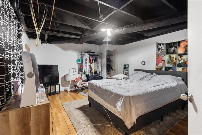 1496 Meadowlark Drive Decatur, GA 30032 - Photo 22 of 27 a bed room with a bed and a tv