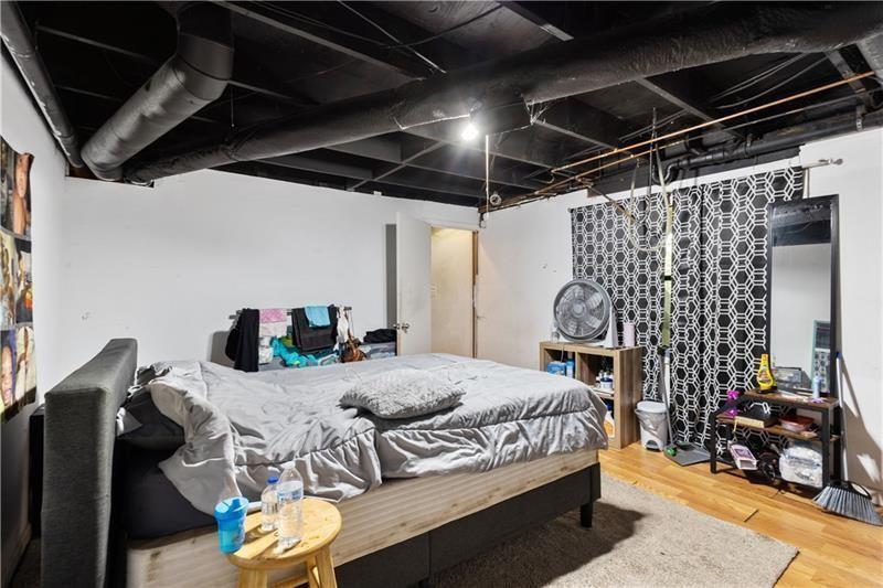 1496 Meadowlark Drive Decatur, GA 30032 - Photo 23 of 27 a bedroom with a bed and a table