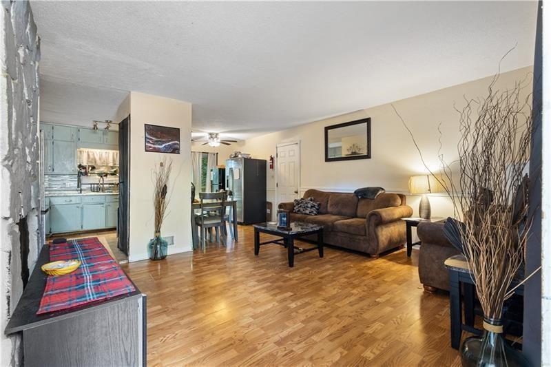 1496 Meadowlark Drive Decatur, GA 30032 - Photo 3 of 27 a living room with furniture and a flat screen tv