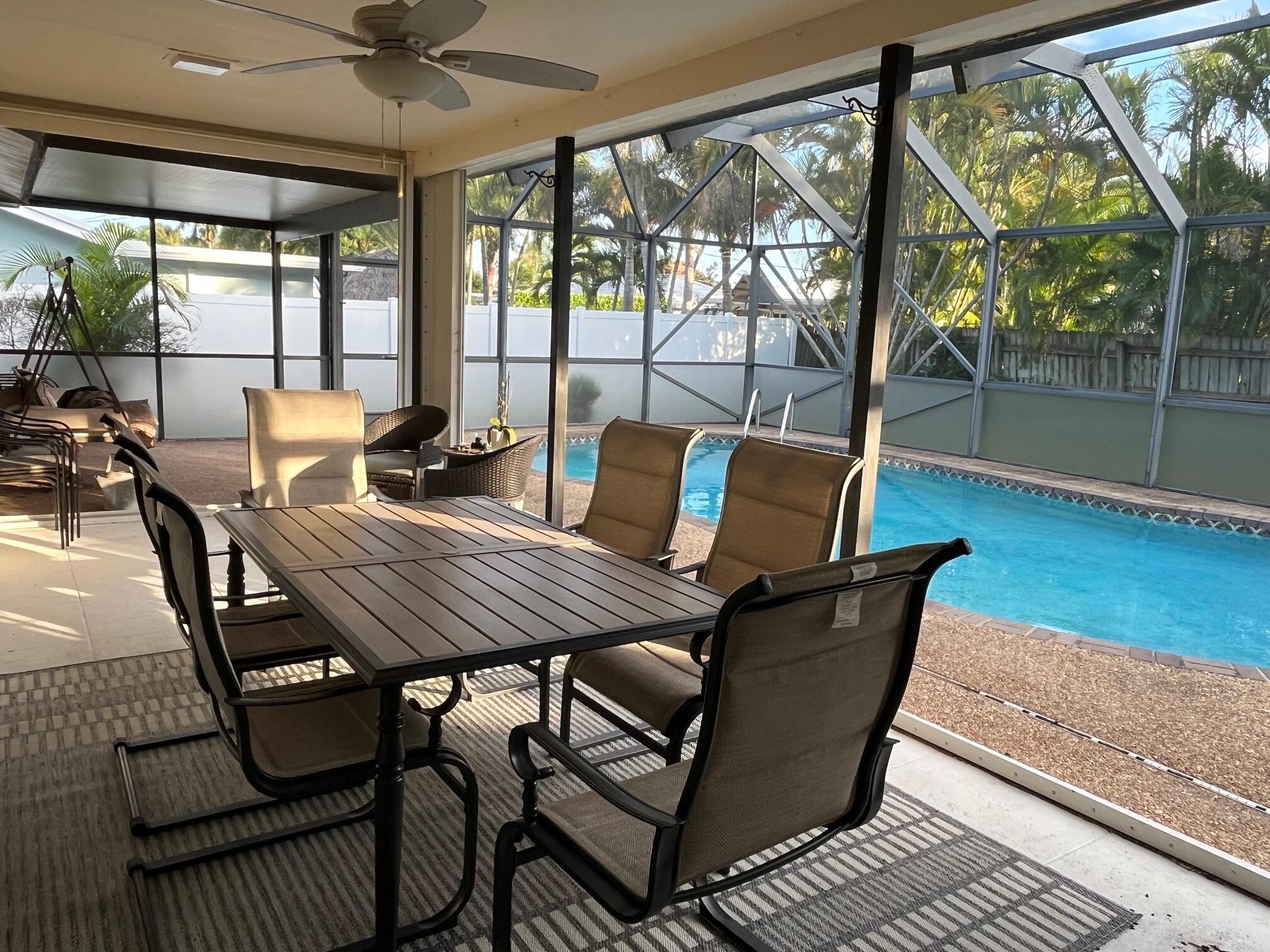 1260 Southwest 8th Street Boca Raton, FL 33486 - Photo 7 of 12 a view of a dining room with furniture wooden floor and a potted plant