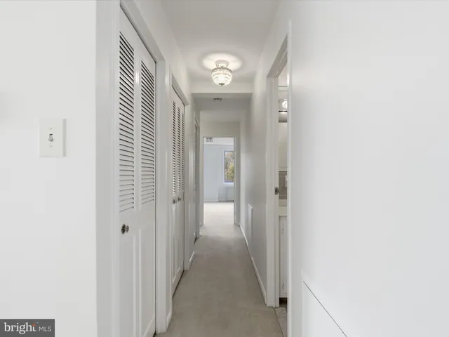 a bathroom with a sink mirror vanity and toilet