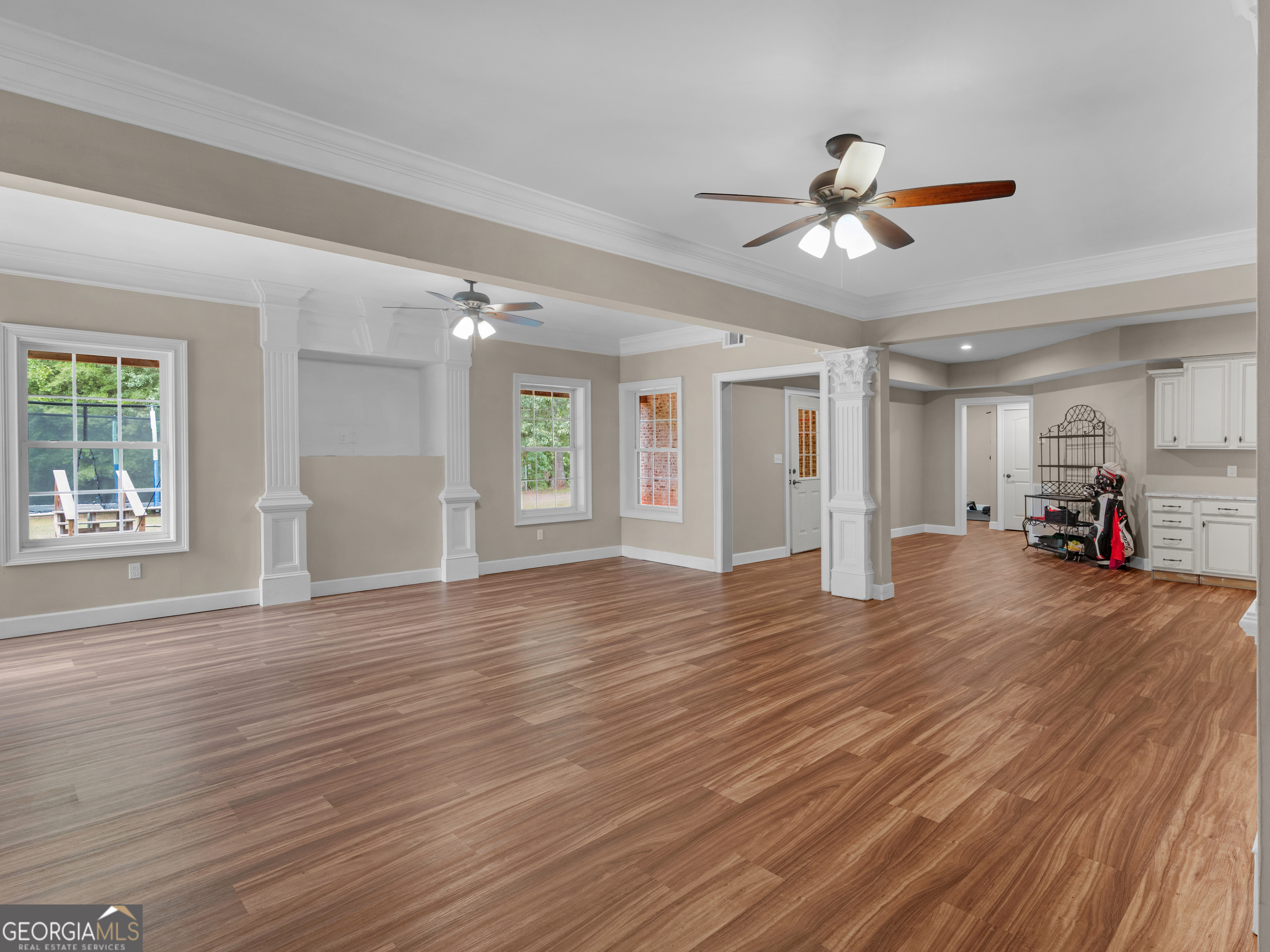 221 Hummingbird Court Hampton, GA 30228 - Photo 49 of 77 a view of empty room with wooden floor and fan