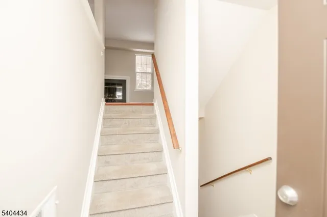 a view of a hallway with staircase