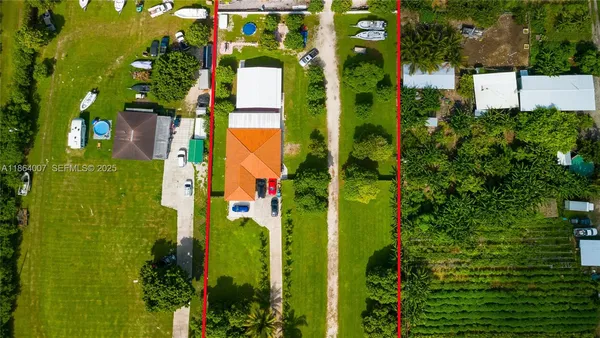 a room with pool table and windows