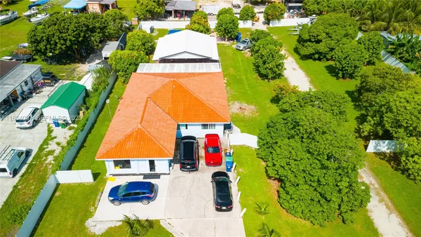 a lobby with furniture and potted plants