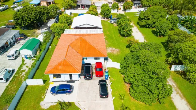 a lobby with furniture and potted plants