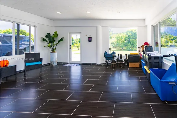 a view of a park with a tree in the background