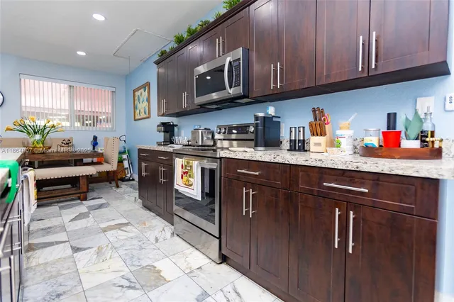 a view of a big yard with table and chairs