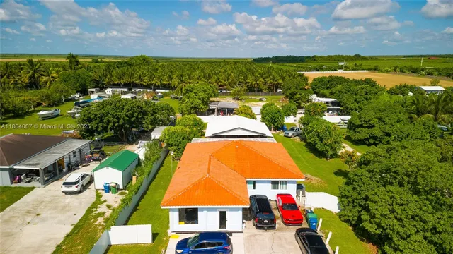 a view of a garden with a building in the background